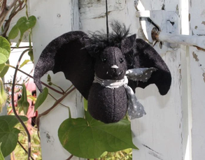 A wool-felt bat ornament with outstretched wings